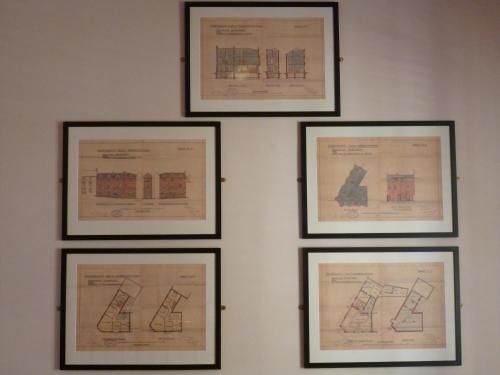four framed drawings of buildings on a wall at Castle Hotel in Aberystwyth