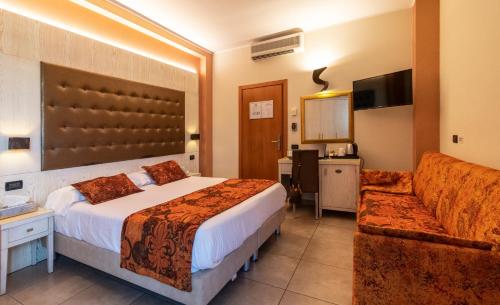 Кровать или кровати в номере Hotel Villa Tiziana