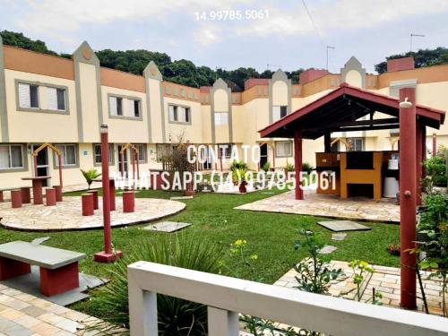 a park in front of a large building at Sobrado para temporada 200m da praia Itapoá SC in Itapoa