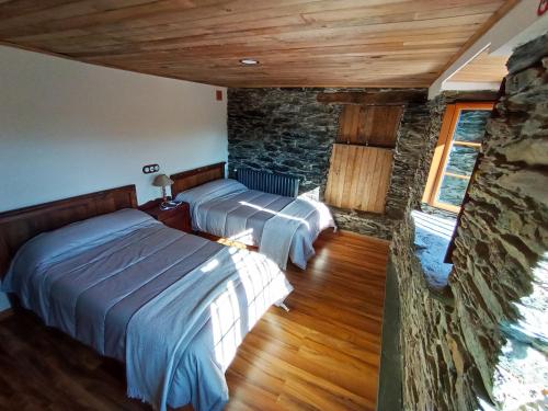 Tempat tidur dalam kamar di Mirador del Navia