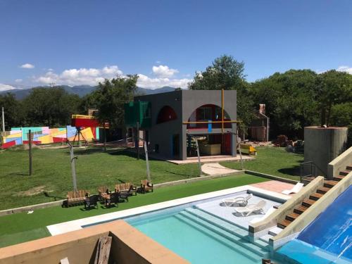 a house with a pool and a playground at Apart Gallery - San Lorenzo - Salta in Salta