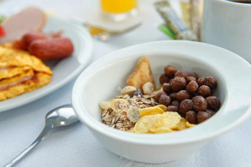 a bowl of cereal and nuts on a table at Hotel Punta in Punta