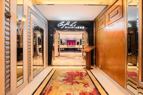 a hallway of a store with a rug on the floor at Radisson Collection Hotel, Xing Guo Shanghai in Shanghai