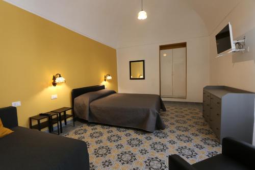 מיטה או מיטות בחדר ב-B&B ex Albergo Centrale ATESSA CENTRO