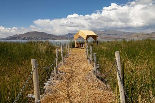 a path through a field with a gazebo at Sonesta Posadas del Inca Puno in Puno