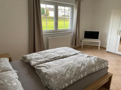 Postel nebo postele na pokoji v ubytování Apartment Mühlbach