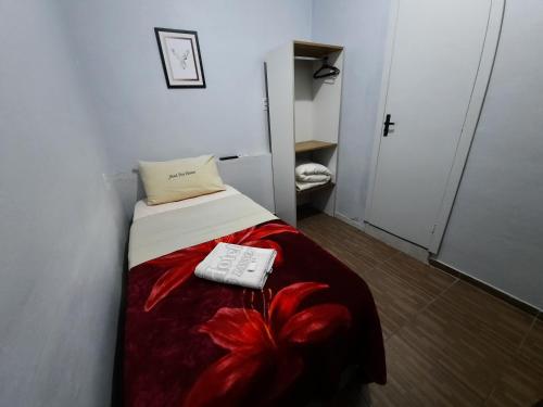Cama o camas de una habitación en Hotel Três Passos - Prox ao Aeroporto e Rodoviária