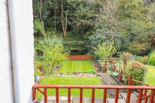 a view of a garden from the balcony of a house at 6 Coltbridge Gardens in Edinburgh