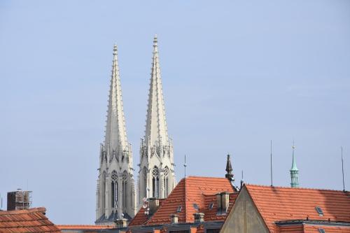 two towers of a cathedral with red roofs at Ferienwohnungen Familie Jäschke in Görlitz