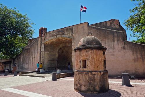 a brick building with a military object in front of it at Hotel Señorial in Santo Domingo