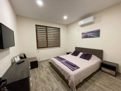 Tempat tidur dalam kamar di Guest House Marchini