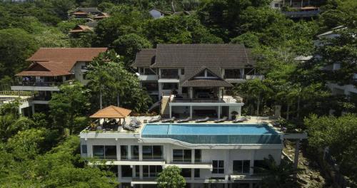 an aerial view of a house with a swimming pool at Villa Yoosook in Patong Beach