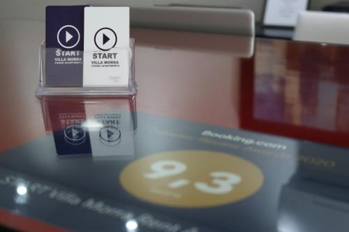a close up of a table with a stack of products at START Villa Morra Rent Apartments in Asuncion