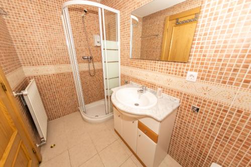 a bathroom with a sink and a shower at Soldeu nature - Parking Gratis - Disfruta En Familia in Canillo