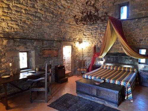 Lova arba lovos apgyvendinimo įstaigoje Castello di Rometta Private Pool
