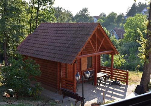 a small wooden cabin with a pitched roof at Baberius in Babe