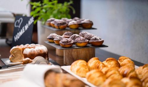 a display of different types of pastries on trays in a bakery at Hotel Residenz Hochalm - Joker Card Partner in Saalbach Hinterglemm