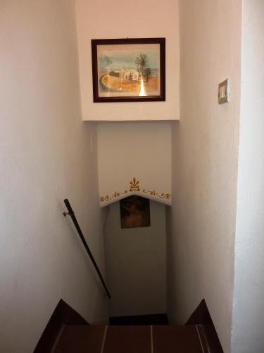 a stairway with a painting on the wall at Casa Nelly in Gallipoli