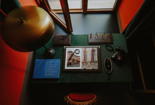a view from the top of a room with pictures on the wall at Hotel Memoire Kutaisi in Kutaisi