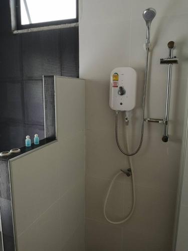 a bathroom with a shower with a shower head at BN Resort in Ban Nong Chum Saeng