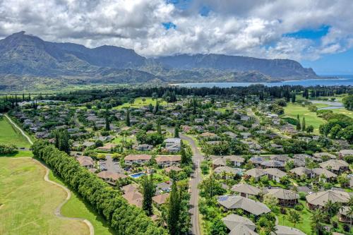 an aerial view of a resort town with mountains at Paniolo #202B in Princeville