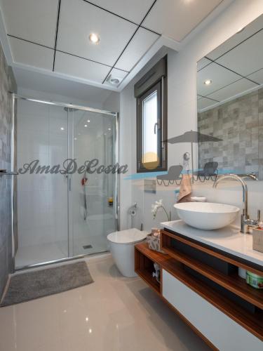a bathroom with a sink and a shower at Villa Dominica in Rojales