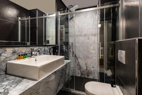 a bathroom with a sink and a toilet at SALA SUITES in Istanbul