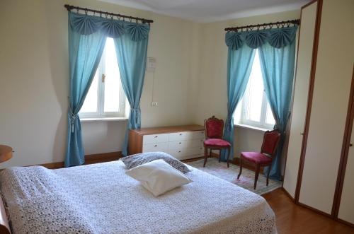 Postel nebo postele na pokoji v ubytování Bed & Bistrò Che Piasì
