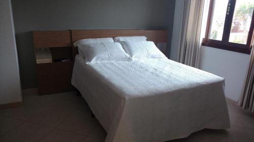 Кровать или кровати в номере JURERÊ INTERNACIONAL SUÍTES