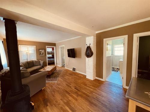 a living room with a couch and a fireplace at Mavericks Corner in Red Lodge