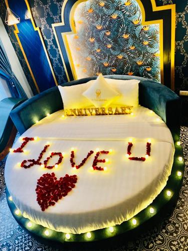 a bed with the word love written on it at Lavie Hotel in Hanoi