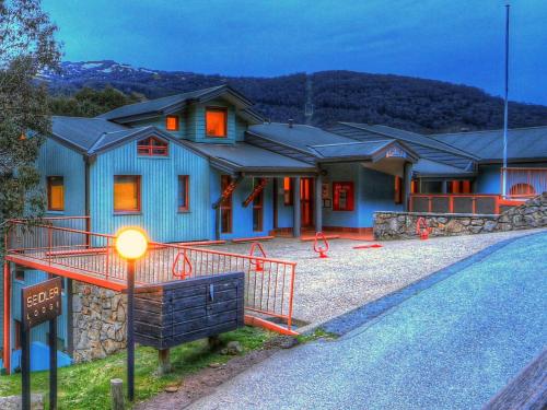 a house with a street light in front of it at Lhotsky Studio 1 Bedroom with quiet location and onsite parking in Thredbo