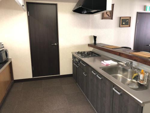Η κουζίνα ή μικρή κουζίνα στο Alpine Chalets Hakuba