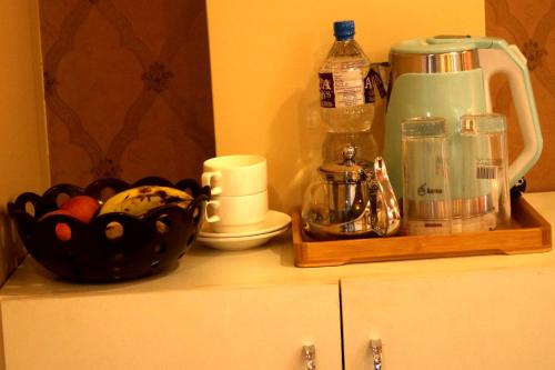 a kitchen counter with a blender and a bowl of food at Hotel Family Ties Pvt. Ltd. in Kathmandu