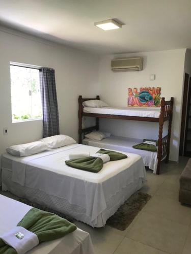 Voodi või voodid majutusasutuse Hotel Pousada Rio Mar toas
