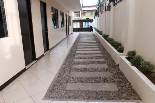 a hallway of an office building with a walkway at Global 88 Apartelle in Cebu City