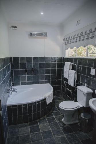 Ένα μπάνιο στο Lydenburg Manor Guest House