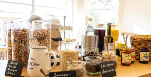 a table with many different types of food and ingredients at Strandbude Borkum in Borkum