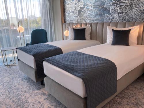 Ένα ή περισσότερα κρεβάτια σε δωμάτιο στο Tisia Hotel & Spa