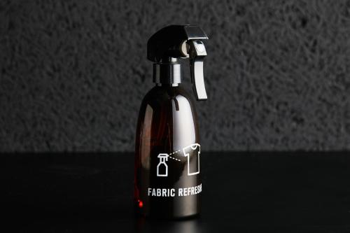 a black and white bottle sitting on a table at mizuka Business Canal City Hakatamae in Fukuoka