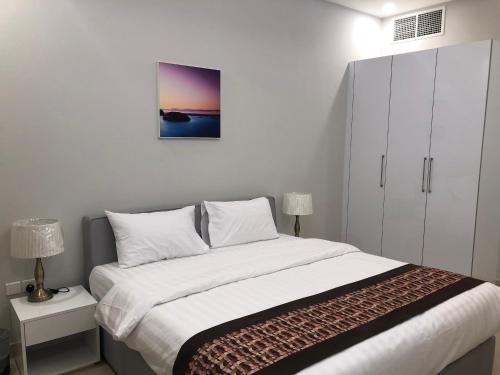 Postel nebo postele na pokoji v ubytování JOOD RESIDENCE