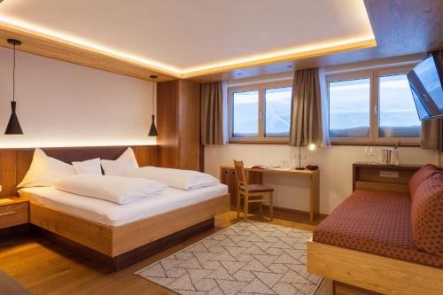 Ein Bett oder Betten in einem Zimmer der Unterkunft Gasthof Valluga