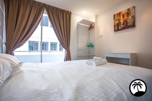 Ένα ή περισσότερα κρεβάτια σε δωμάτιο στο Paradise Suite at Asiacity