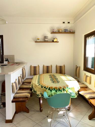 a room with a table and a chair in it at La Dolce Vista in Tremezzo