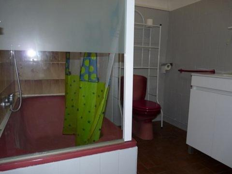 a bathroom with a shower with a toilet and a window at Maison-Ville, Plages, commerces, parc à pied, wifi, stationnement gratuit à Vaux in Vaux-sur-Mer