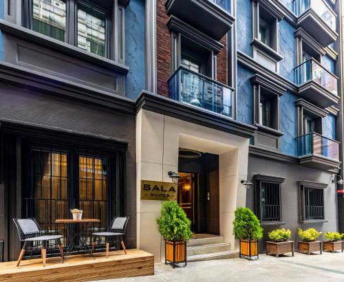 a building with a table and chairs in front of it at SALA SUITES in Istanbul