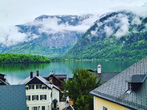 a view of a lake in front of a mountain at Pension Leopoldine in Hallstatt