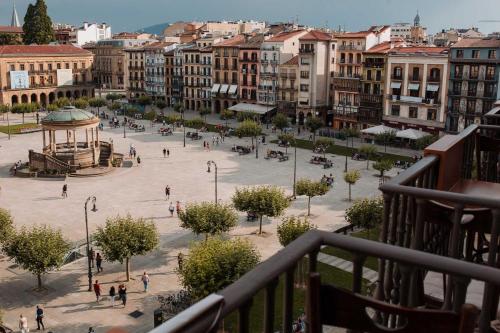 a view of a plaza in a city with buildings at Gran Hotel La Perla in Pamplona