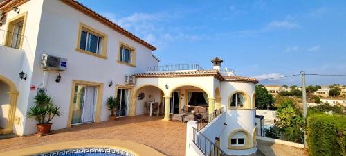 a large white house with a balcony at B&B Vista Mar in Benissa