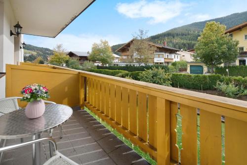 a balcony with a table and a view at Haus Lowe Appartement 1 Stock Nr 3 in Filzmoos